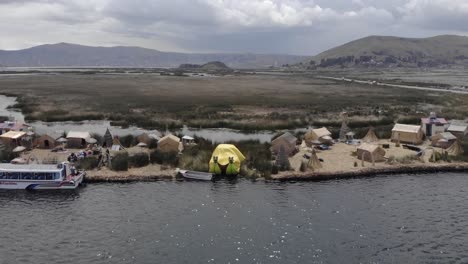 Dramatic-reed-tourist-boat-under-yellow-tarp-at-Uros-Floating-Islands