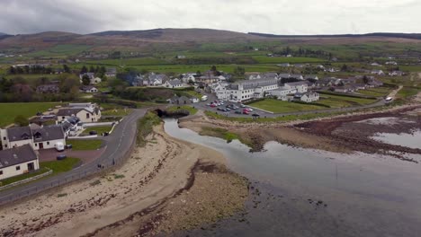 Aerial-view-of-the-Scottish-town-of-Blackwaterfoot-on-the-Isle-of-Arran-on-an-overcast-day,-Scotland