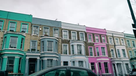 Time-lapse-shot-of-colorful-houses-during-cloudy-day-and-traffic-in-Notting-Hill-a-district-of-London