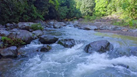 Higuero-river-running-through-rocks-in-forest,-La-Cuaba-in-Dominican-Republic