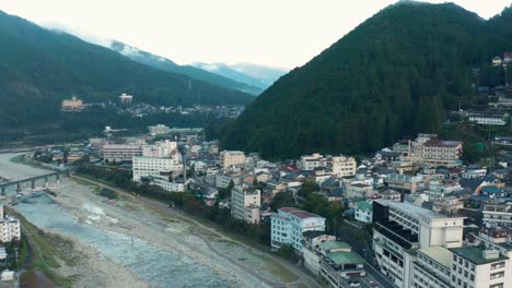 Gero-Onsen-in-early-morning,-Aerial-Pan-Over-Gifu-Prefecture-Hot-Spring-Town