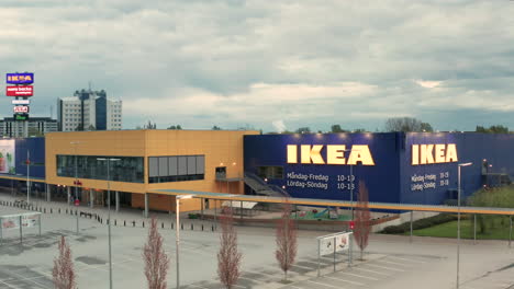 AERIAL-of-a-deserted-IKEA-store-carpark-in-Borlange,-Sweden