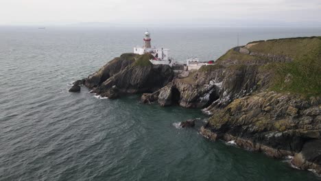 Aerial-View-Of-Baily-Lighthouse,-Howth,-County-Dublin,-Ireland---drone-shot