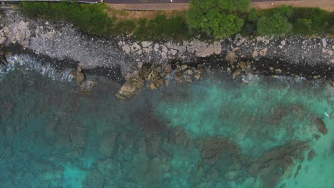 Drone-shot-of-a-rocky-shoreline-beach-in-Hawaii