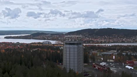 Flying-towards-majestic-tower-with-city-of-Ostersund-in-background