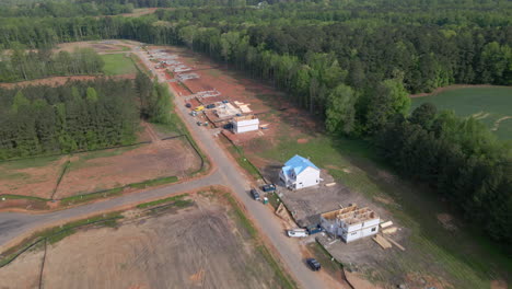 Cinematic-drone-shot-of-homes-being-built,-new-construction