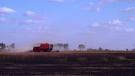 Medium-shot-of-a-combine-harvesting-soybean-in-a-field-in-rural-Santa-Fe,-Argentina