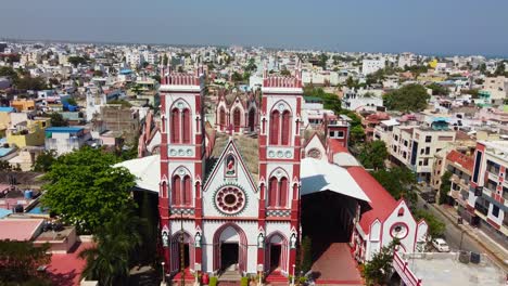 Drone-shot-of-Basilica-of-the-Sacred-Heart-of-Jesus,-situated-on-the-south-boulevard-of-Pondicherry-in-Puducherry,-India,-is-an-oriental-specimen-of-Gothic-architecture