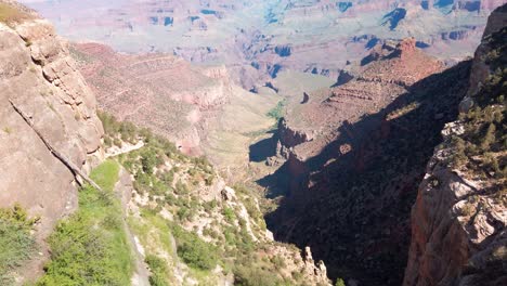 Tilting-up-shot-from-wild-grass-to-the-Grand-Canyon