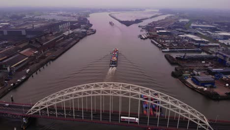 Aerial-View-Over-Brug-Over-De-Noord-With-Maas-Cargo-Ship-Passing-Underneath