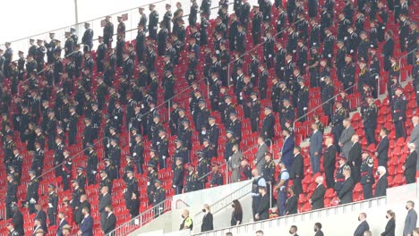 Numerous-hundreds-of-police-officers-stand-in-tribute-at-an-event-in-stadium,-canada,-August-31,-2021