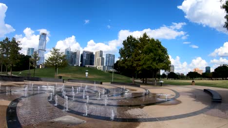 A-smooth-steady-pan-from-the-Liz-Carpenter-Splash-pad-in-Butler-park-and-the-Austin-Skyline-in-the