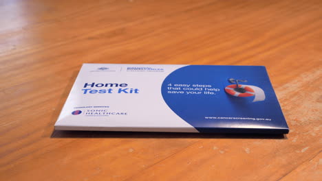 DOLLY-IN-Bowel-Cancer-Home-Screening-Test-Kit-On-Table