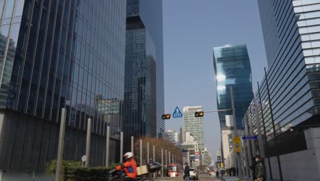 Samsung-Headquarter-HQ-Glassy-Towers-in-Gangnam-district-and-people-walking-by-wearing-protective-masks
