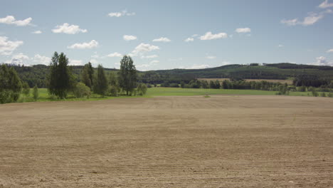 LONG-TERM-TIMELAPSE-ZOOM-IN-of-a-ploughed-field-turning-green-with-crops