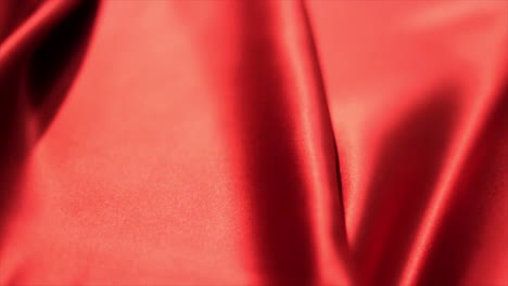 Blatt-Aus-Rotem-Satin-Textilgewebe,-Hintergrund-Der-Textilindustrie-Mit-Kopierraum-Und-Ohne-Menschen