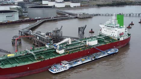 Silver-Rotterdam-oil-petrochemical-shipping-tanker-loading-at-Tranmere-terminal-Liverpool-aerial-view-zoom-in-closeup