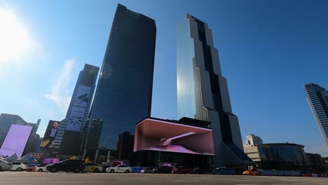 SMtown-Coex-Artium-with-Largest-curved-LED-Digital-outdoor-Billboard-Screen,-Trade-Tower-And-Parnas-Skyscrapers,-South-Korea