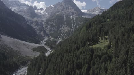 video-with-drone-plane-frontal-or-advance-on-landscape-of-the-step-stelvio-with-mountain-with-snow-to-the-horizon