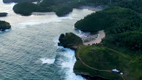 Paradise-beaches-between-cliffs-on-Kasap-coast,-East-Java-Indonesia,-aerial-view