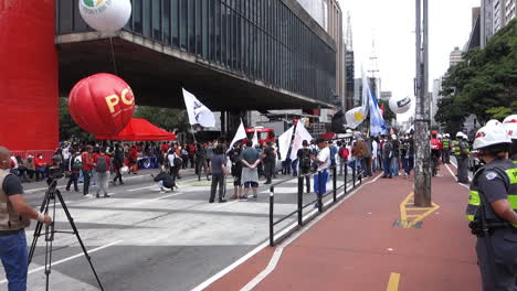 Sao-Paulo,-Brazil,-Black-Consciousness-Protest,-People-With-Flags-on-Paulista-Avenue-in-Front-of-MASP-Building-and-Police-Squad,-Slow-Motion,-Wide-View