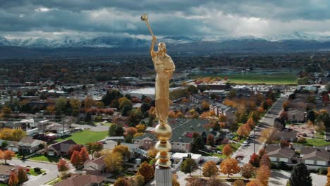 Iconic-golden-Angel-Moroni-statue-at-Brigham-Jordan-Utah-aerial