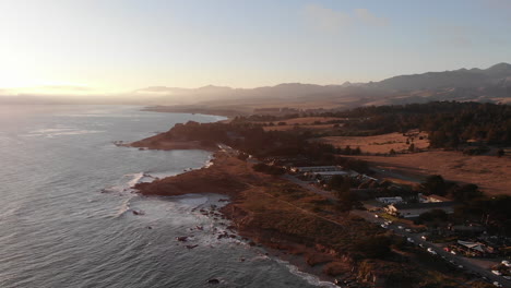Drone-rotates-around-Pacific-Coast-Highway-as-waves-crash-at-golden-hour