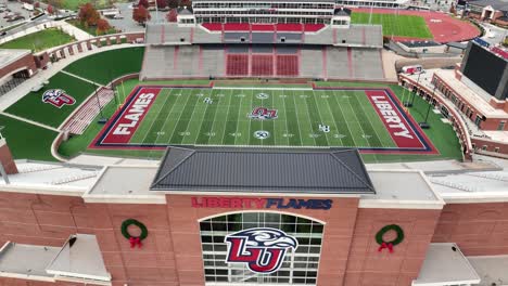 Descending-aerial,-Liberty-University-Flames-football-field