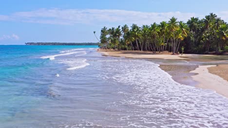 Aerial-forward-over-Caribbean-Playa-Coson,-Las-Terrenas-in-Dominican-Republic