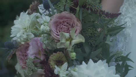 Closeup-of-bride's-flower-bouquet-on-wedding-day