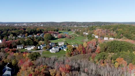 Beautiful-town-of-Haverhill-with-beautiful-autumn-colors,-aerial-drone-fly-forward-view