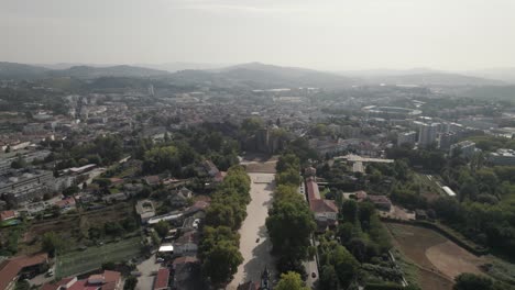 Aerial-view-of-Castle-of-Guimaraes-historic-european-landmark,-pull-in-shot