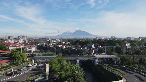 The-train-that-crosses-the-urban-bridge-and-looks-at-the-beautiful-view-of-Mount-Merapi
