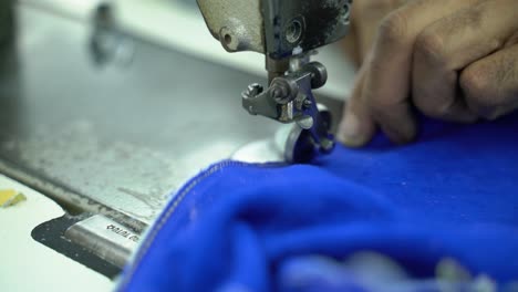 Closeup-Of-Fashion-Gloves-Being-Manufactured-In-A-Clothing-Sweatshop