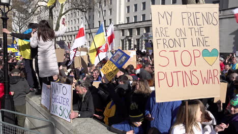 People-hold-up-various-handmade-cardboard-placards-with-messages-and-statements-opposing-the-Russian-invasion-of-Ukraine-at-a-protest-opposite-Downing-Street