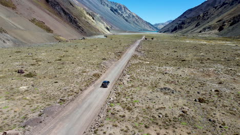 Aerial:-SUV-on-mountain-road