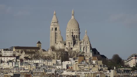 Super-zoom-telephoto-view-of-church-on-hilltop-in-Europe-city-HD-30p