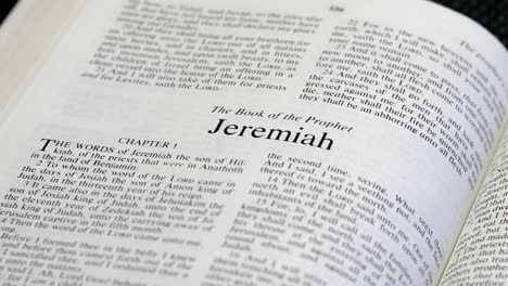 Close-Up-Shot-of-Bible-Page-Turning-to-the-book-of-Jeremiah