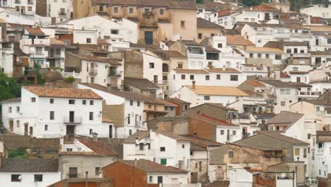 Camera-pans-across-the-entire-village-of-Chulilla-with-small-white-traditional-Spanish-houses-on-the-mountain-side