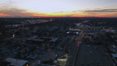 An-aerial-time-lapse-over-a-suburban-neighborhood-at-sunset