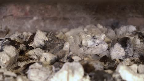 Close-up-of-smoking-hot-coals