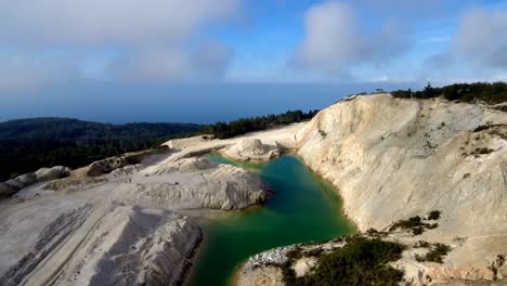 Aerial-View-Over-Green-Toxic-Lake-At-Monte-Neme-Abandoned-Mine