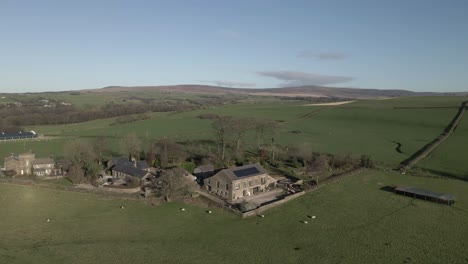 Old-English-stone-farm-house-with-sheep-pasture-and-solar-panels