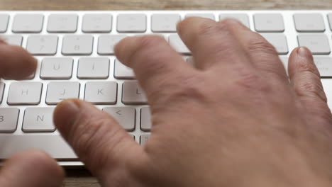 pov-typing-on-an-apple-magic-keyboard-closeup-with-camera-movement
