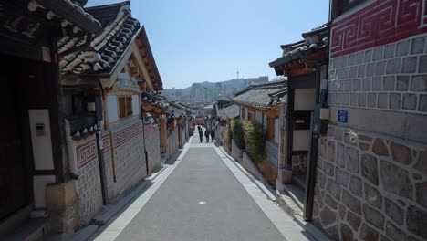 Historic-Korean-Neighborhood-in-Bukchon-Hanok-Village-in-Seoul,-South-Korea-with-Namsan-Tower-view