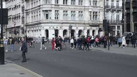 People-Crossing-The-Road-At-Parliament-Square-In-Westminster