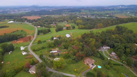 Aerial-Drone-shot-of-the-farms,-mountains,-and-valleys-of-Virginia-during-the-wedding-day-of-a-newly-wed-couple