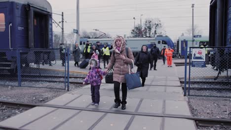 Ukrainian-refugees-got-off-the-train-and-go-to-the-registration-point-for-refugees-from-Ukraine