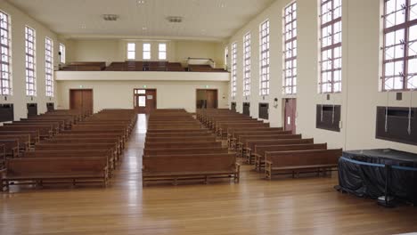 Old-fashioned-School-Auditorium,-Wooden-Flooring-and-Benches