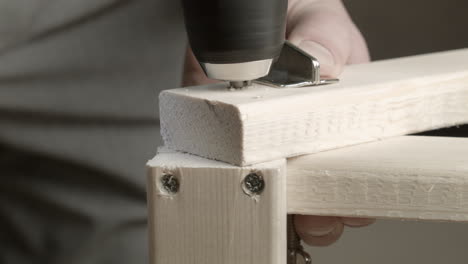 Screw-holes-drilled-into-pine-lumber-for-home-construction-project